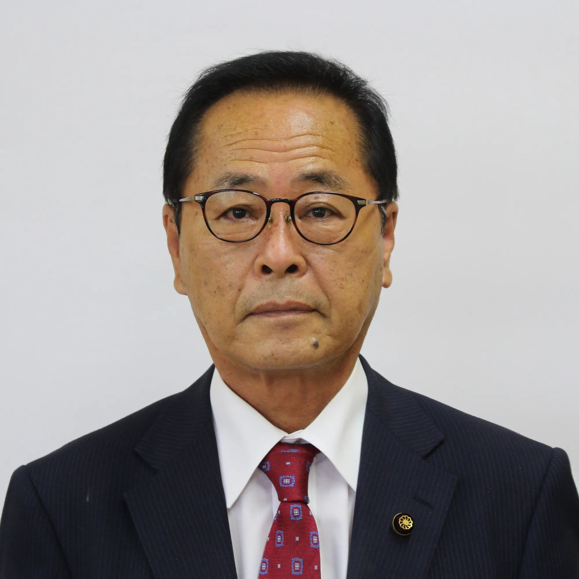 津本辰己議員 顔写真
