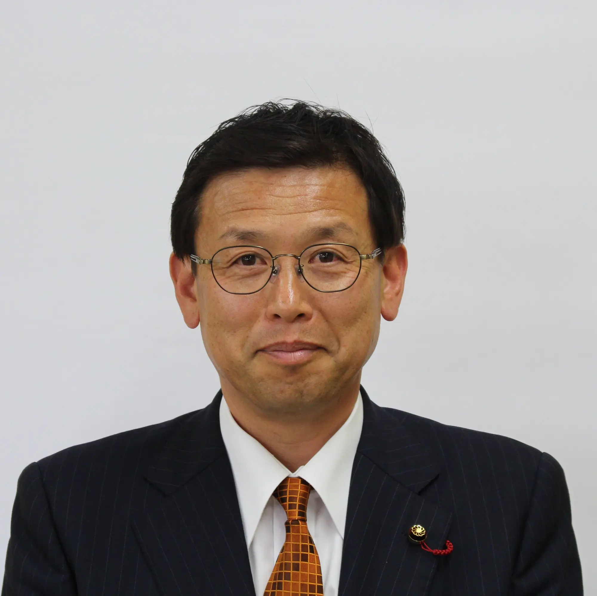 金田稔久議員 顔写真